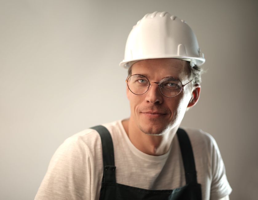 Friendly window installation contractor smiling
